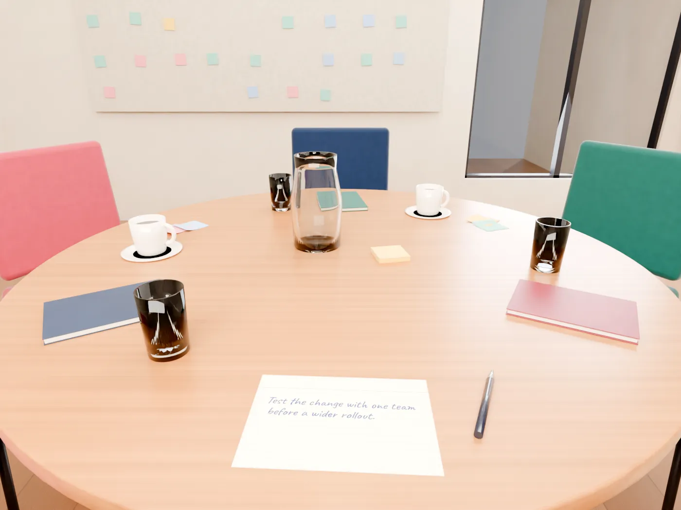 A round table set for six: notebooks, cups and sticky notes at each place, colourful empty chairs, a wall of notes behind. Your handwritten card lies in front of you.