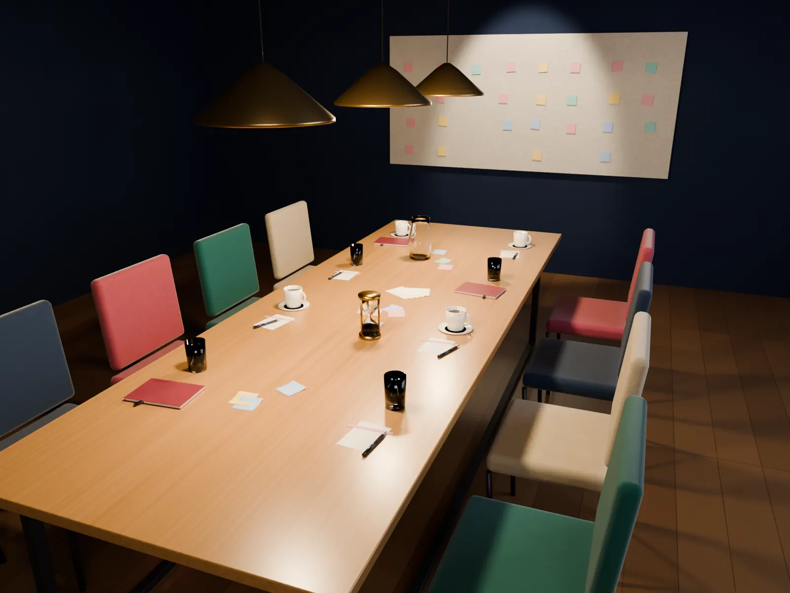 A long table prepared for a workshop under warm pendant lights: scenario cards, sticky notes, notebooks and a sand timer at the centre, colourful chairs, a pin-board of notes on the far wall.