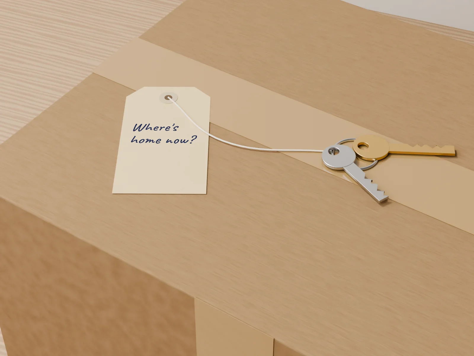 A taped moving box with a new set of keys on a ring and a manila tag that asks: Where's home now?